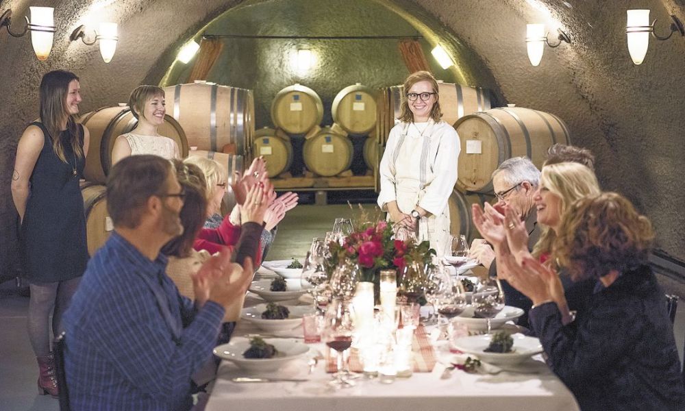 Chef Kali Martin receives a round of applause from the eight guests at the dinner titled LOVE hosted in Archery Summit’s barrel caves.##Photo by Andrea Johnson