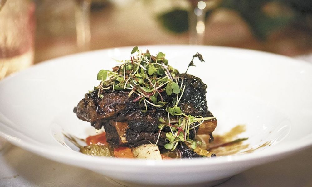 The fourth dish, cocoa-rubbed short ribs with winter vegetables, is served with two 2012 Pinots from Archery Summit, Renegade Ridge and Looney Vineyard.##Photo by Andrea Johnson