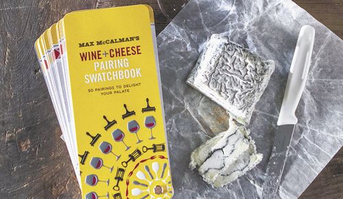 “McCalman’s Wine + Cheese Pairing Swatchbook” pairs well with a glass of white wine and Sofia goat cheese from Capriole in Indiana.##Photo by Christine Hyatt
