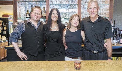 Tina’s new owners, (from left) Michael and Dawn Stiller, and
Karen and Dwight McFaddin, stand in the bar of their newly
acquired restaurant.