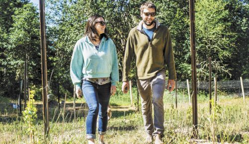 Jure Poberaj and Nina Jimenez in their newly planted vineyard in the hills above White Salmon, Washington. ##Photo by Joshua Chang