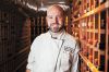 Chef Chris Czarnecki at the Joel Palmer House, standing in his restaurant’s wine cellar. ##Photo Provided