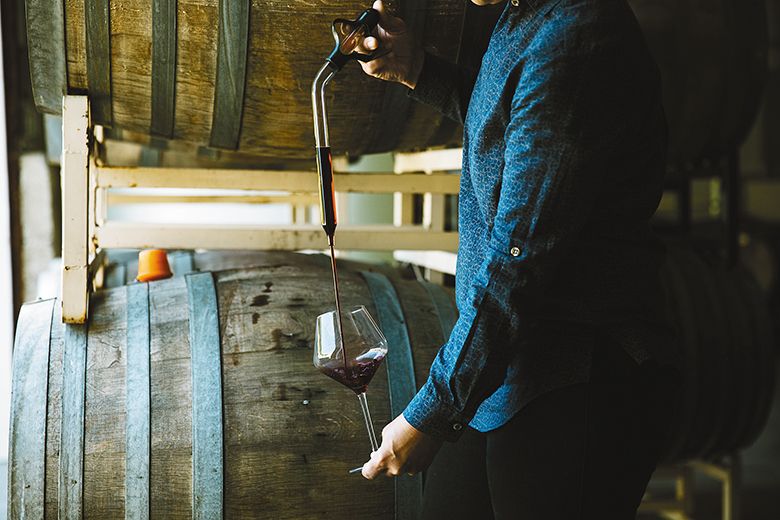 Remy Wines’ owner Remy Drabkin pouring a barrel sample into a wine glass. ## Photo by Cheryl Juetten Remy Wines’ owner Remy Drabkin pouring a barrel sample into a wine glass. ## Photo by Cheryl Juetten