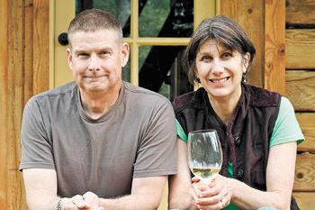 Vern and Gianaclis Caldwell, owners of Pholia Farm, relax on the porch of their self-built
home in Rogue River.