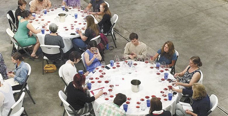 Guests at the event work on tasting notes for the wines, all made from Dundee Hills fruit.