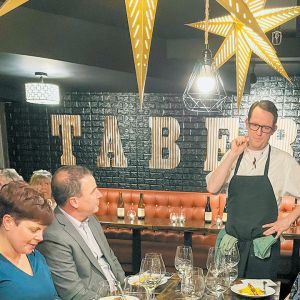 Cozy Taberna s chef  Christopher Robertson as he explains his meal to diners. ##Photo by Gail Oberst