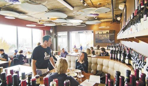 Chef/co-owner Leather Storrs chats with diners at his Southeast Portland wine bar, Noble Rot, which was established in 2002. Photo provided.