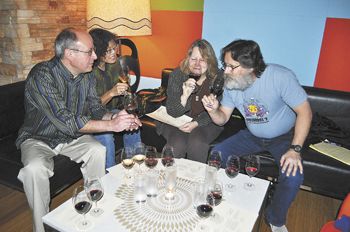 Friends from Corvallis (from left), Patrick Hadlock, Cynthia Spencer, Jerri Bartholomew and John Kaufman sample wine
and small plates at Vino Paradiso in Portland.