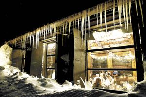 Merriment at the R. Stuart & Co. wine dinner glows through the icicle-draped windows of the Silcox Hut. Photo by DS Imagery.