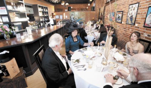 Period-attired Jerry and Susan Murphy enjoy the oysters Rockefeller at Latitude one’s titanic 100th anniversary dinner in Dallas, OR