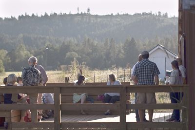 Guests mingle outside the barn before the dinner begins. Photo provided.