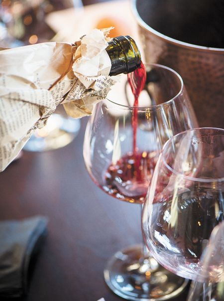 Wine is poured for a premium Pinot Noir blind tasting featuring wines priced at $100 or more.