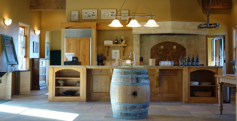 The tasting room offers warm colors and rustic wood. ##Photo provided