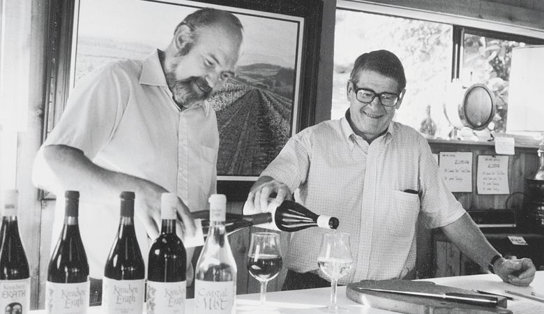Dick Erath (left) and Cal Knudsen pour glasses of wine from Knudsen Erath Winery.
##Photo courtesy of Oregon Wine History Archive