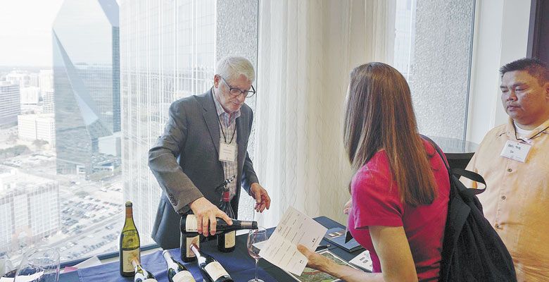 David Adelsheim pours his namesake wine at the Pinot in the City event in Dallas, Texas. ##Photo by Dan Eierdam