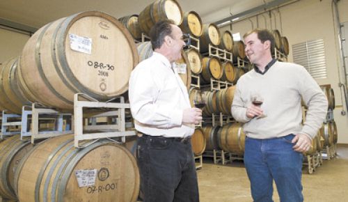 David Bergen, of Tina s Restaurant, and Russel Gladhart, of Winter s Hill, discuss land-use issues at Gladhart s winery.  Both were selected to be part of an expert panel.  Photo by Marcus Larson, News-Register.