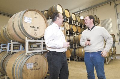 David Bergen, of Tina s Restaurant, and Russel Gladhart, of Winter s Hill, discuss land-use issues at Gladhart s winery.  Both were selected to be part of an expert panel.  Photo by Marcus Larson, News-Register.