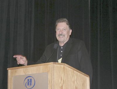 Lonnie Wright, of the Pines 1852 in the Columbia Gorge, receives the Lifetime Achievement Award from the Oregon Wine Board at this year s Oregon Wine Symposium.  Photo courtesy of OWB.