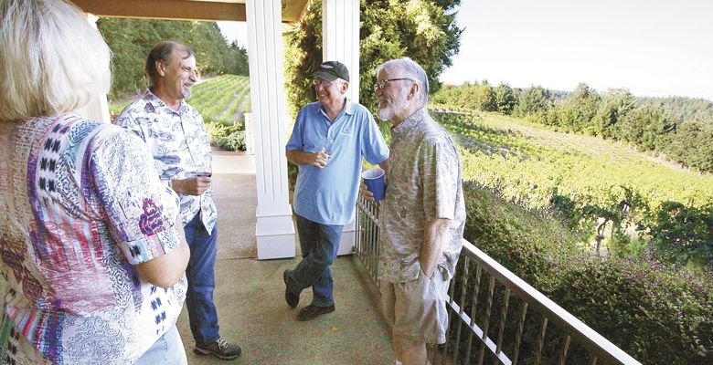 Susanna Brown (from left), Al McDonald, John Totten and Dick O’Brien chat during the Salem Growers’ Group annual summer picnic, Aug. 3, at BeckenRidge Vineyard in Dallas. ##Photo by Rockne Roll