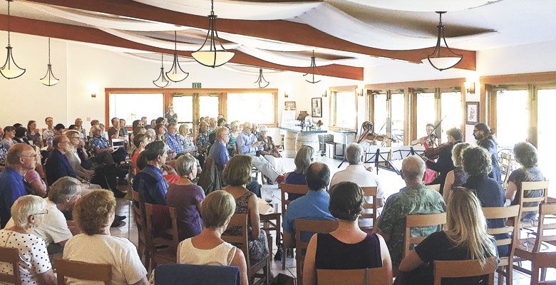 Guests enjoy the sounds of the Willamette Valley Chamber Music Festival at Elk Cove Vineyards on Aug. 21. ##Photo courtesy of Ken Friedenreich