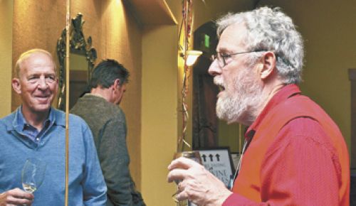 Myron Redford of Amity Vineyards talks with a guest at this year’s Equinox, Eola-Amity Hills Winegrowers Association’s annual tasting event.