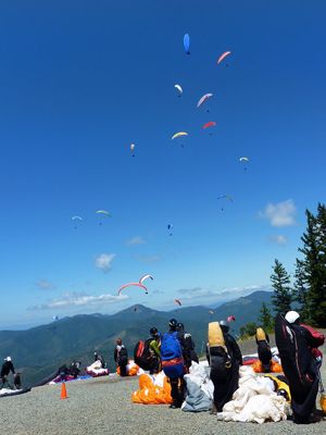 Participants in last year’s paragliding competition get ready to launch off Woodrat Mountain, only two miles from Fiasco Winery, near Jacksonville.