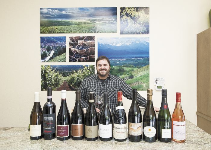 Jeff Woodard, owner of newly opened Woodard Wines, displays a selection of favorites from his inventory.Photo by Marcus Larson