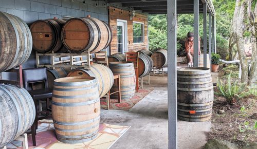The tasting room at Varmum Vintners in Amity takes care to separate guests using barrels.  ##Photo provided
