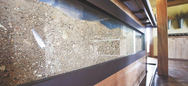 A display in Lenné’s tasting room shows the Peavine soil present in the vineyard. ##Photo by Rockne Roll