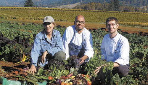 Executive Chef Michael Landsberg (right),
Garden Manager Jessie Russell (left) and Sous
Chef Benjamin Nadolny gather organic produce
from King Estate’s 30 acres of gardens and
orchards.