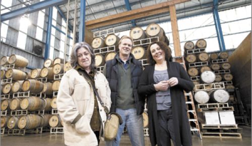 Partners Trish Rogers, national sales, Rob Stuart, general manager and winemaker, and Maria Stuart, direct sales and marketing, in the main fermentation room of R. Stuart & Co. in Mc-
Minnville’s Pinot Quarter. The facility has served as home base since 2002, the same year R. Stuart
launched its Big Fire label.