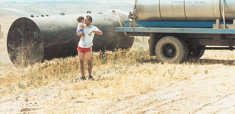 Rick Small, Woodward Canyon Winery s founding winemaker and co-owner, holding daughter Jordan Small, taken during the mid  80s at the Woodward Canyon Estate Vineyard. ##Photo provided by Woodward Canyon Winery