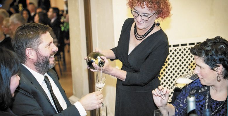 Mich Nelson pours sparkling for winemaker Josh Bergström and his wife, Caroline, at the Saturday gala hosted by Domaine Serene.  ##Photo by Andrea Johnson