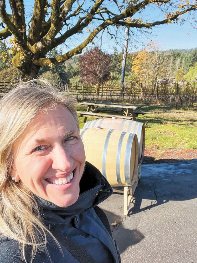 Sarah Murdoch is all smiles on her final day of the 2022 harvest at Hazelfern Cellars. ##Photo by Sarah Murdoch