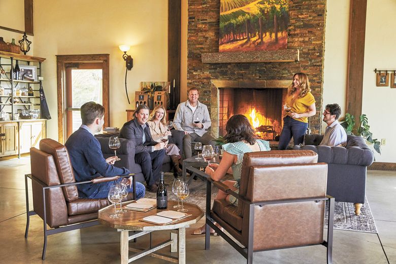 Built in 2015, Soléna Estate’s lodge-style tasting room in Yamhill includes a cozy hearth and private cellar space. ##Photo by John Valls