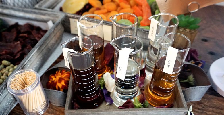 Spring s table of taste identifiers, including flasks of bitters, helps guests recognize some of the flavors and aromas in the wines. ##Photo by Viki Eierdam