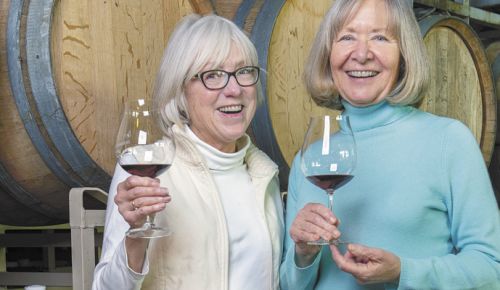 Carol Stalp (left) and Billie Olson toast the new year during their visit to Elizabeth Chambers Cellar. ##Photo by Rusty Rae