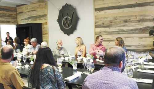 A group gathers for a multi-course dinner paired with Wooldridge Creek wines on Sept. 8 at Vinfarm. ##Photo by Maureen Battistella