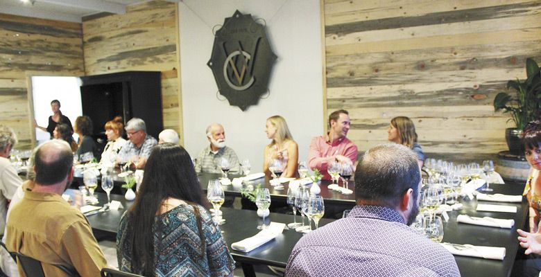 A group gathers for a multi-course dinner paired with Wooldridge Creek wines on Sept. 8 at Vinfarm. ##Photo by Maureen Battistella