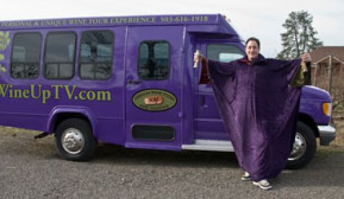 Wayne Oppenheimer poses in his  wine Wizard  costume in front of his tour bus. Oppenheimer is host of the new www.WineUpTV.com.