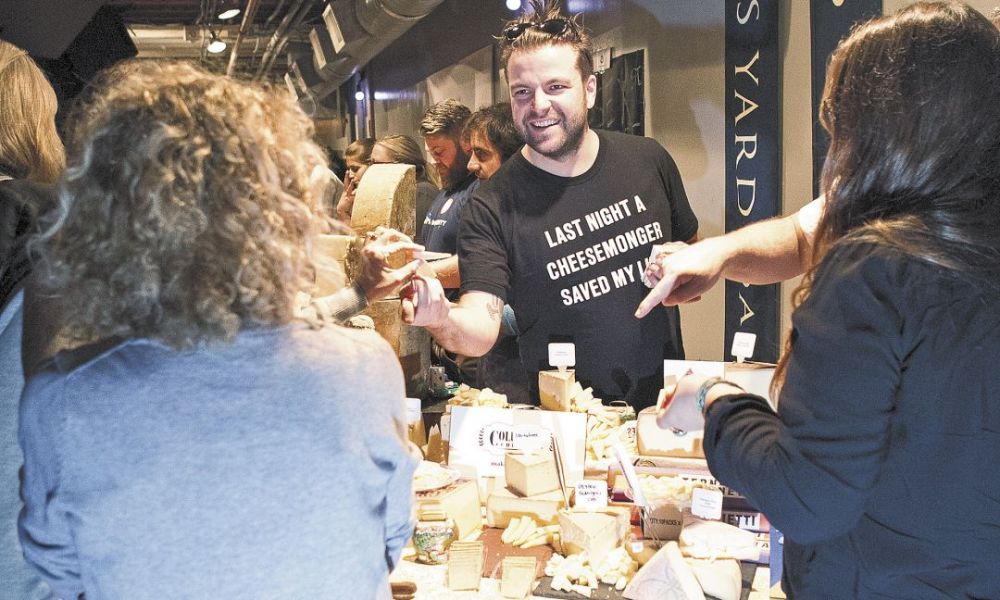 Guests savor a wide selection of fine Alpine and German cheeses at the event held at Public Works in San Francisco.##Photo by Christine Hyatt