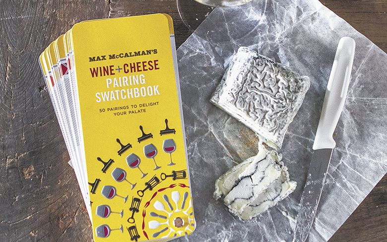 “McCalman’s Wine + Cheese Pairing Swatchbook” pairs well with a glass of white wine and Sofia goat cheese from Capriole in Indiana.##Photo by Christine Hyatt