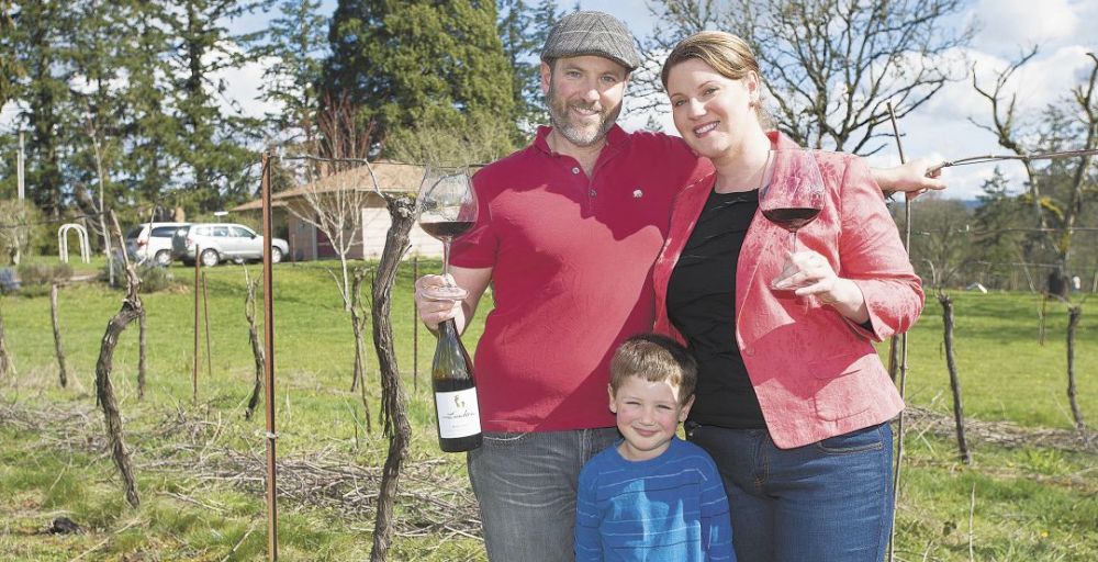 Michael and Desiree Lundeen with their son, Colin, outside their home on Poverty Bend Farm, just outside of McMinnville, where the couple grows winegrapes and lives in Michael’s father’s childhood home.##Photo by Marcus Larson