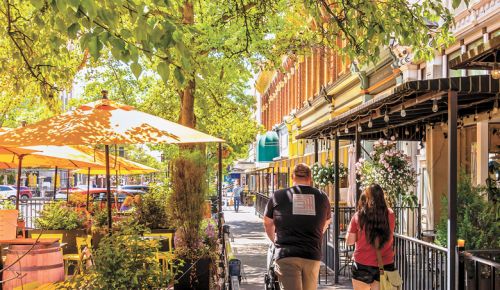 A family out for a stroll on the tree-lined streets of downtown Walla Walla. ##Photo by Richard Duval