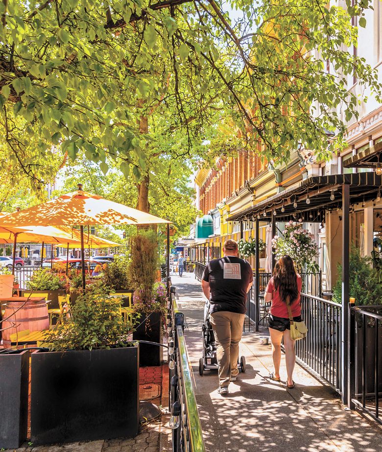 A family out for a stroll on the tree-lined streets of downtown Walla Walla. ##Photo by Richard Duval