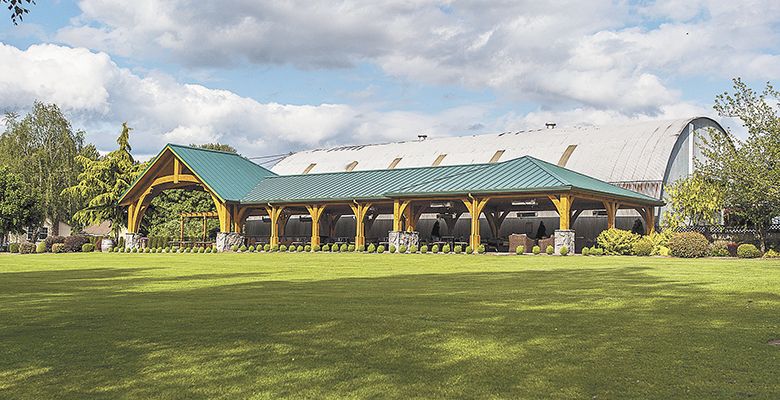 Next to the winery, the Housers built an extensive covered patio perfect for weddings and small gatherings, too.##Photo by Del Munroe