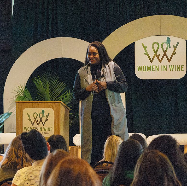 Libra Forde, executive director of the Women’s Foundation of Oregon, speaking to the conference audience. ## Photo credit: Fahrner Creative Libra Forde, executive director of the Women’s Foundation of Oregon, speaking to the conference audience. ## Photo credit: Fahrner Creative