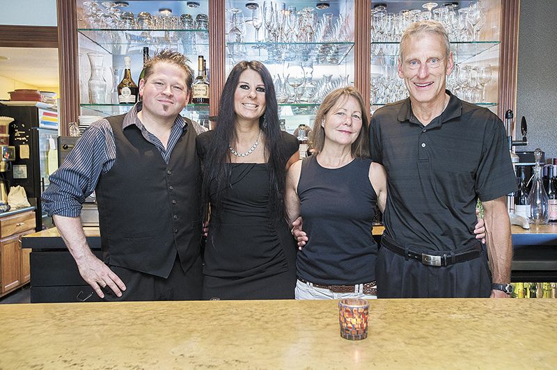 Tina’s new owners, (from left) Michael and Dawn Stiller, and
Karen and Dwight McFaddin, stand in the bar of their newly
acquired restaurant.