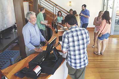 Gino Cuneo helps customers at The Latin Corner.##Photo provided Gino Cuneo helps customers at The Latin Corner.##Photo provided