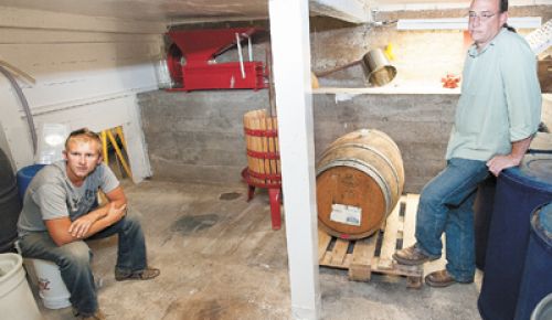 Xylem Wines partners Forrest Schaad, left, and Jason Brumley survey their mini-winery in the basements of Brumley s McMinnville home.